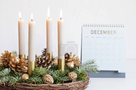 Photo for Handmade modern advent wreath with four candles lit every sunday before christmas. Traditional diy xmas decoration - Royalty Free Image