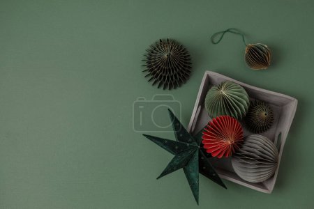 Photo for Scandinavian christmas paper honeycomb ornaments in the box. Modern sustainable christmas decoration, minimalist and plastic free. Top view, flat lay - Royalty Free Image