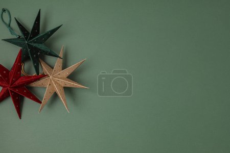 Photo for Scandinavian christmas paper stars ornaments in the box. Modern sustainable christmas decoration, minimalist and plastic free. Top view, flat lay - Royalty Free Image