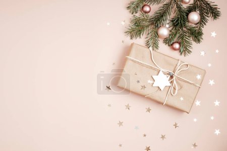 Photo for Christmas background with gift box. Xmas celebration, preparation for winter holidays. Festive mockup, top view, flatlay - Royalty Free Image