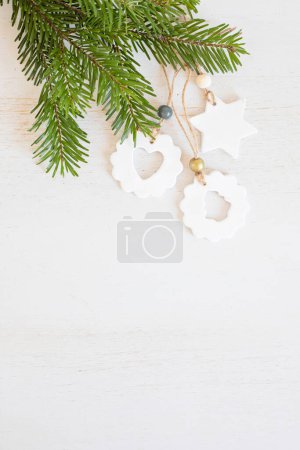 Photo for Top view of handmade christmas ornaments made of air dry clay. Xmas crafts, hobby, diy concept - Royalty Free Image