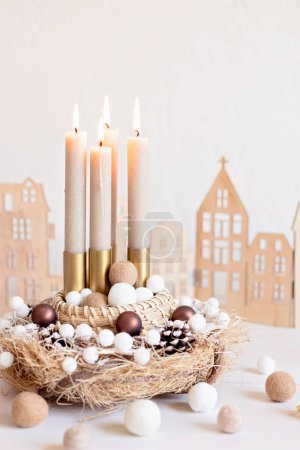Photo for Handmade modern advent wreath with four candles lit every sunday before christmas. Traditional diy xmas decoration - Royalty Free Image