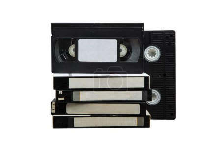 Foto de Montón de casetes de vídeo VHS. Medios vintage. Aislar sobre un fondo blanco. - Imagen libre de derechos