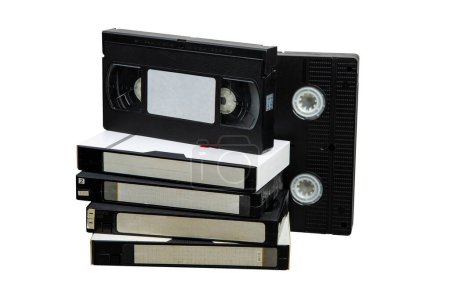 Téléchargez les photos : Pile of VHS video cassettes. Vintage media. Isolate on a white background. - en image libre de droit