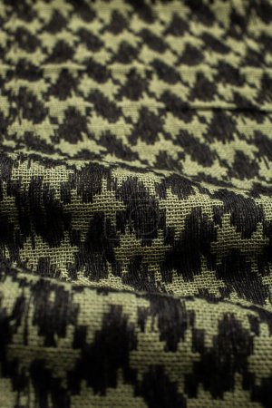 Photo for Keffieh scarf. The texture of the cotton traditional symbolic arabian scarf. Khaki background. - Royalty Free Image