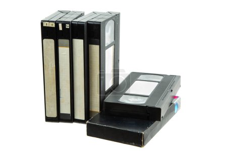 Foto de Pile of VHS video cassettes. Vintage media. Isolate on a white background. - Imagen libre de derechos