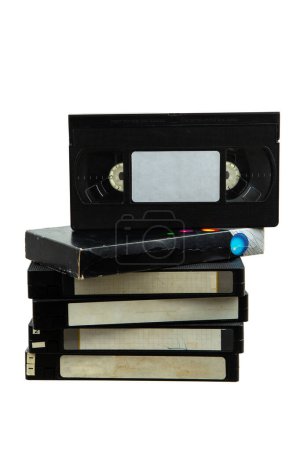 Foto de Pile of VHS video cassettes. Vintage media. Isolate on a white background. - Imagen libre de derechos