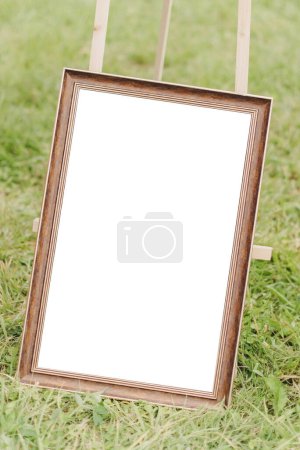Photo for Mockup frame close up at a street fair or flea market on the grass - Royalty Free Image