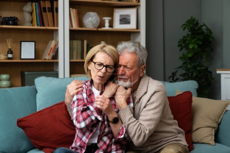 Photo for Senior couple husband and wife man and woman, hugs seriously ill woman for support feels her pain regrets her health problem Supporting and loving the chosen one of his life he suffers from depression - Royalty Free Image