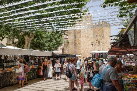 Photo for Alcudia, Spain - 9 July, 2023: Market day in the Old town of Alcudia, Mallorca - Royalty Free Image