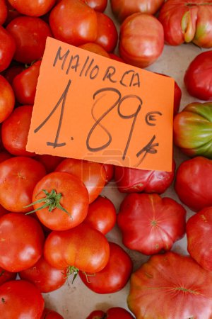Photo for Alcudia, Spain - 9 July, 2023: Fresh tomato on sale on a stall at Alcudia market, Mallorca - Royalty Free Image