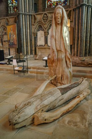 Photo for Durham, UK - July 12, 2023: The Pieta, a wooden sculpture of the Christ and mother Mary. Durham Cathedral, England - Royalty Free Image