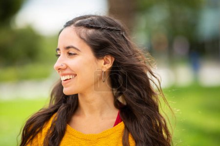 Photo for Close up side portrait of smiling young woman - Royalty Free Image