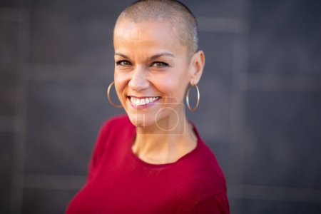 Photo for Portrait of smiling woman with short shaved hair - Royalty Free Image