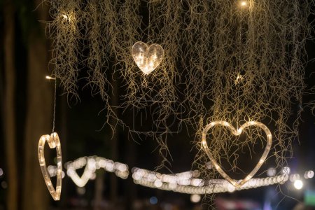 Photo for Hanging heart shape light decoration at park to celebrate valentine's day. - Royalty Free Image