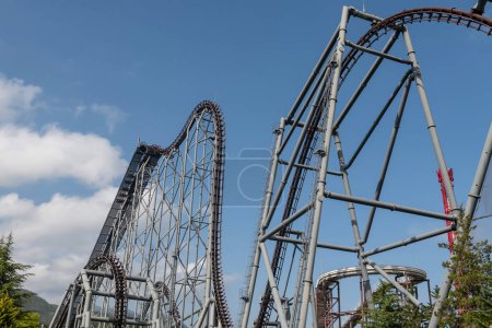 Photo for Roller coaster against blue sky at Fuji-Q Highland, Yamanashi, Japan. - Royalty Free Image
