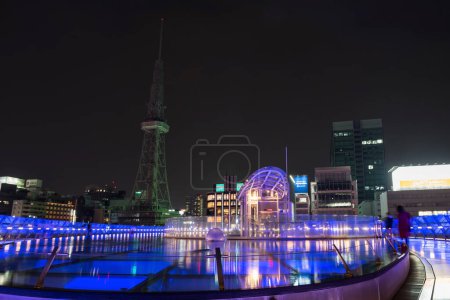 Photo for Nagoya, Japan - April 7, 2019: Rooftop floor of Oasis 21, modern facility located adjacent to Nagoya TV Tower at night in Sakae, contains restaurants, stores, and a bus terminal. - Royalty Free Image