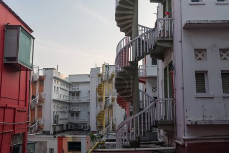 Top architecture view of amazing colorful exterior spiral staircases shophouse in Bugis, Singapore.