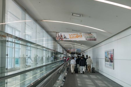 Photo for Fukuoka, Japan - Mar 30, 2024: Arrival people walk in Fukuoka airport terminal to meet immigration. Here is airport in island of Kyushu and the fourth busiest passenger airport of Japan. - Royalty Free Image