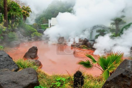 Chinoike Jigokuor Blood pond hell with heavy steam in Beppu, Oita, Japan. Here is pond of hot red water and famous photogenic of the eight hells.