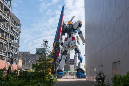 Photo for Rear of life size RX 93ff  Gundam robot statue against blue sky at Mitsui Shopping Park LaLaport. - Royalty Free Image