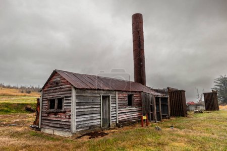 Photo for Waiuta is a remarkable relic of early gold mining days, a ghost town now but once a busy mining settlement. The Waiuta quartz mine, in the hills between Greymouth and Reefton, was New Zealands third largest gold mine, producing nearly 750,000 oz - Royalty Free Image
