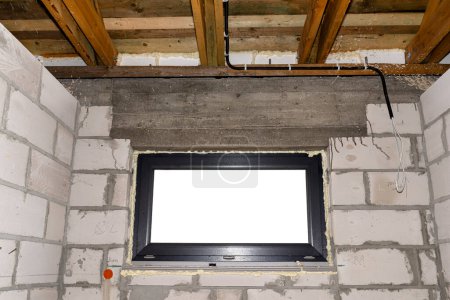 Photo for Warm installation of a three-layer window with a polystyrene window sill, view from the inside. - Royalty Free Image