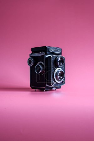 Photo for Yashica-A antique camera on pink background - Royalty Free Image