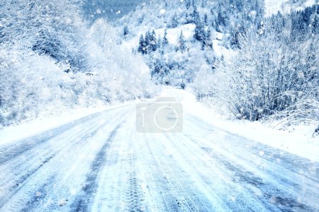 Photo for Snow covered road in the mountains on a snowy day - Royalty Free Image