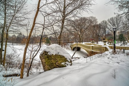 Photo for Bow bridge, Central Park, New York City after snow storm in winter - Royalty Free Image