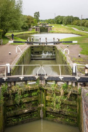 Photo for NORTHAMPTONSHIRE, UK - May 25, 2022. Series of canal locks on the Grand Union Canal at Stoke Bruerne - Royalty Free Image
