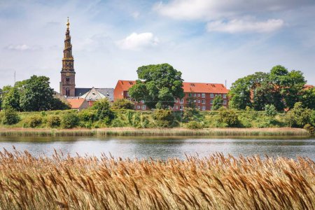 Photo for Christianshavns Vold nature reserve with the Church of Our Saviour in the background. Copenhagen, Denmark - Royalty Free Image