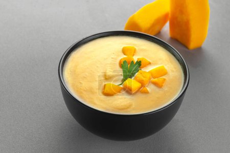 Photo for Vegan curried pumpkin lentil soup puree in a bowl. Space for text. Pescatarian Eating, Flexitarian Eating, Reducetarian Eating - Royalty Free Image