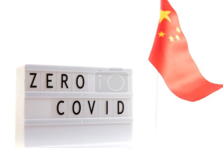 Photo for Zero Covid inscription on a dark background with a Chinese flag. Protest and Cancel Quarantine. - Royalty Free Image