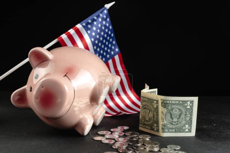 Photo for Piggy bank with dollars open on a black background. The global financial crisis. The problem with savings is that savings are not being saved - Royalty Free Image
