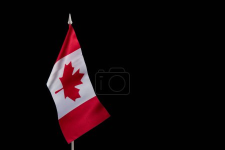 Photo for Small national flags of the Canada on a black background. - Royalty Free Image