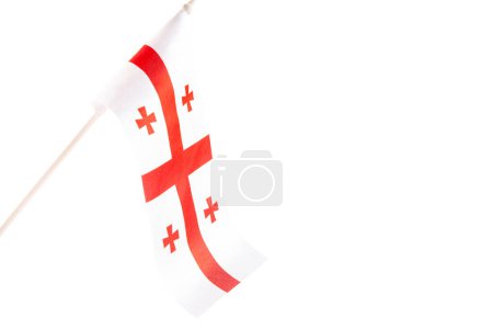 Photo for The flag of Georgia on a white background develops and flies waving in the wind. Isolate - Royalty Free Image