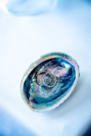 Photo for Wedding ring on a paua shell, wedding accessories, celebration details. High quality photo - Royalty Free Image