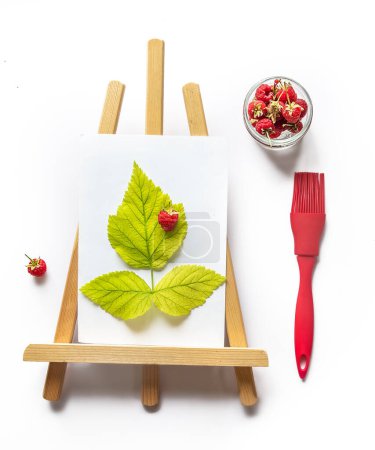 Photo for Fresh ripe raw raspberries with green leaves isolated over white set on a white paper as a drawing, creative summertime and healthy eating concept. High quality photo - Royalty Free Image
