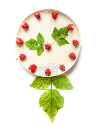 Photo for Clocks made of fresh organic raw raspberries isolated over white background, healthy eating, summer harvest, summertime vibes. High quality photo - Royalty Free Image