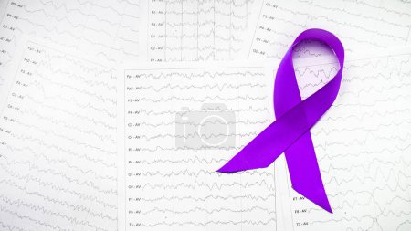 Téléchargez les photos : International Epilepsy Day, Epilepsy awareness. Purple ribbon on brain wave on electroencephalogram EEG for epilepsy. - en image libre de droit