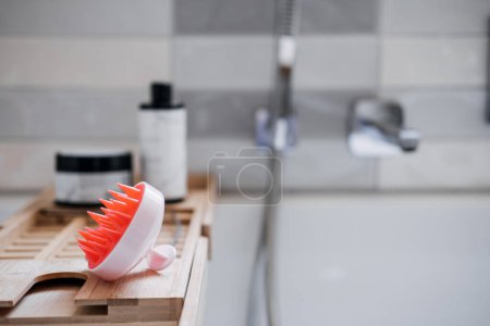 Photo for Shampoo Brush. Silicone Exfoliator Massager brush for circulation and follicle stimulation for optimal scalp health. Silicone Scrubber in the bathroom. - Royalty Free Image