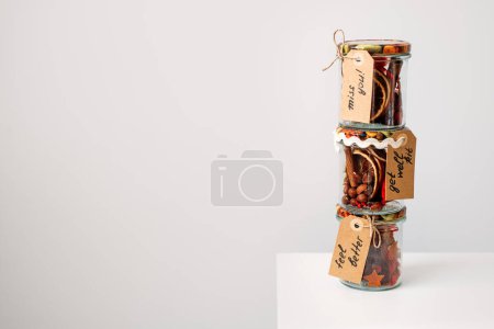 Photo for Gift in jar ideas. Get Well Soon Gifts kit with vitamins, nuts, spices, dry oranges, Cinnamon Sticks in jars. Care package, gift box for a sick friend. Feel Better Gifts, Thinking of You Gift kit. - Royalty Free Image