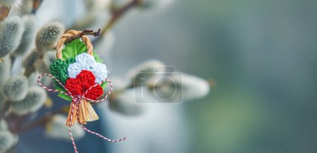 Photo for The Martisor, a handcrafted red and white talisman, symbolizing springs arrival, celebrated internationally on March 1. - Royalty Free Image