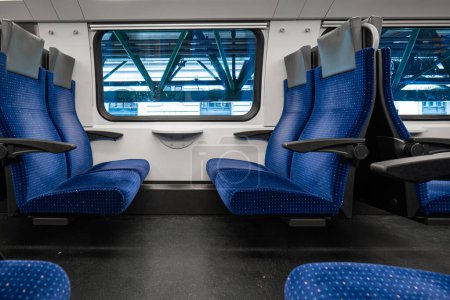 Passenger train with empty seats. Wide-angle view of an empty train in Switzerland, Europe, no people.