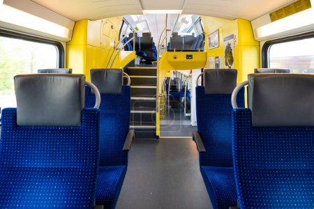 Photo for Empty seats on a passenger train in Europe. Wide-angle view, day time, no people. - Royalty Free Image