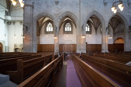 Photo for Reformed European church interior with empty wooden pews. Ultra wide angle view, no people - Royalty Free Image