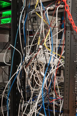 Photo for Messy tangled electric cables connecting to industrial lab devices on a rack, no people - Royalty Free Image