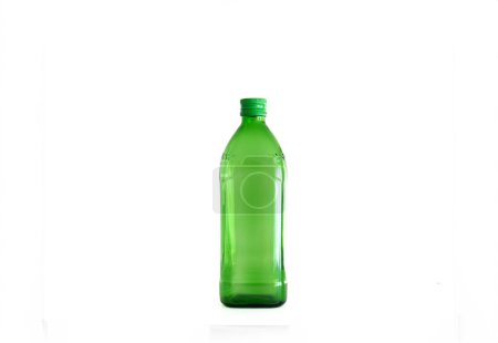Large green empty glass bottle isolated on white.