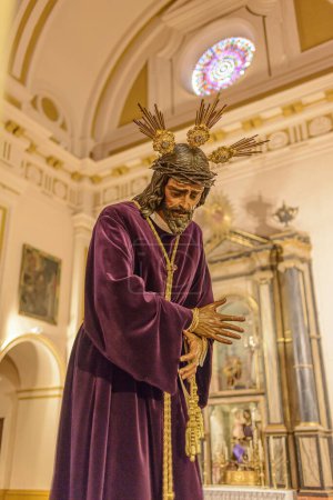 Photo for Arahal (Seville), Spain. 8 April 2022. Our Father Jesus of Nazareth exposed in "besamano" (kissing) for the faithful days before his departure in procession on Good Friday - Royalty Free Image